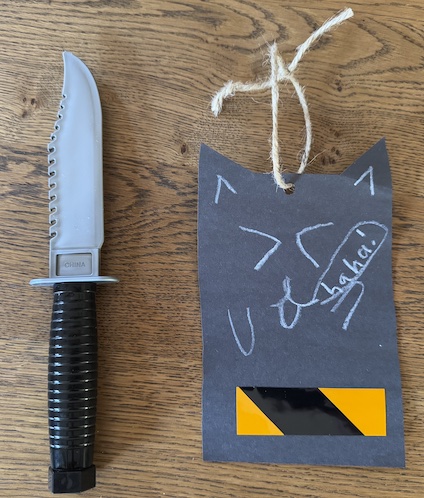 fake knife and kitty cat